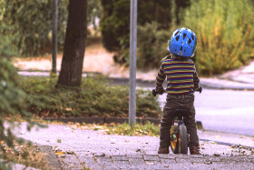 Stock Image: child learns to ride a bicycle