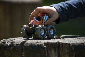 Stock Image: child plays with toy monster truck
