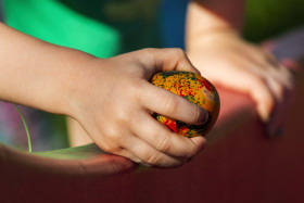 Stock Image: child with a easter egg in hand
