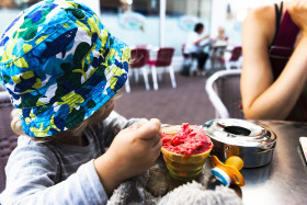 Stock Image: child with strawberry ice cream cup