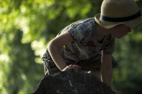 Stock Image: childred climbs on a rock