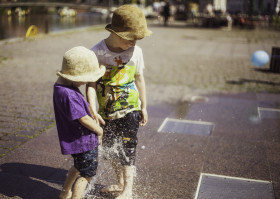 Stock Image: children play at the fountain