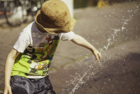 Stock Image: children play at the fountain