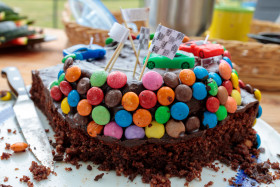 Stock Image: Chocolate birthday cake with cars