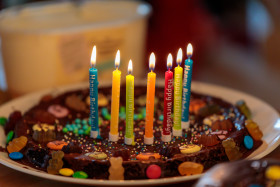 Stock Image: Chocolate birthday cake with seven candles