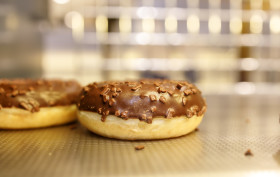 Stock Image: Chocolate Donuts in shop window