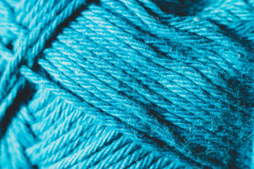 Stock Image: Close up the blue yarn background