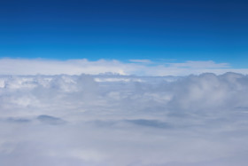 Stock Image: Clouds and sky from airplane window view