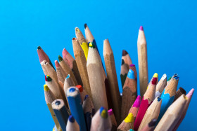 Stock Image: color pencils on blue background