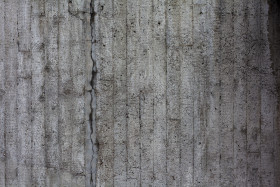 Stock Image: concrete stone wall texture with cracks background