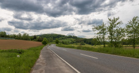 Stock Image: Country road through the countryside in Hesse near Kassel