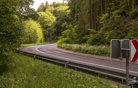 Stock Image: country road through the forest