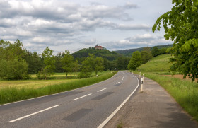 Stock Image: Country road through the rural area of Melsungen in Hesse, Germany