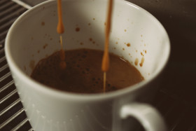 Stock Image: cup in coffee machine