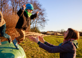 Stock Image: cute boy jumps in mother arms