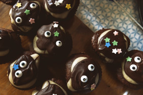 Stock Image: cute chocolate muffins with face