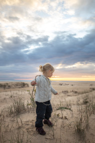 Stock Image: Cute girl on a sunset beach in spain