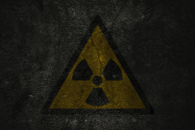 Stock Image: dark grunge radioactive symbol background