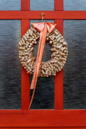 Stock Image: Decorative door wreath made from old wine corks