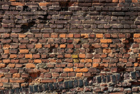 Stock Image: Destroyed old red brick wall texture