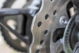 Stock Image: Detail of a motorcycle's disk brake