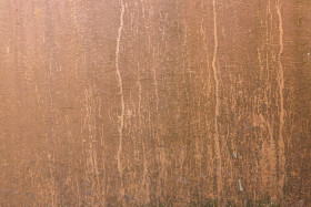 Stock Image: Dirty weathered copper coloured wall texture