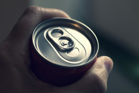 Stock Image: drink can - cola can in a hand softdrinks