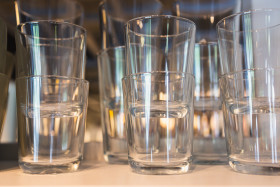 Stock Image: Drinking glasses in kitchen cabinet