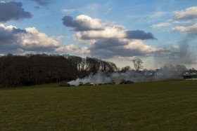 Stock Image: Easter fire from afar - German rural landscape - traditional festival