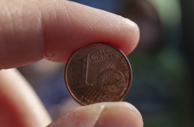 Stock Image: euro coin in hand 1 cent