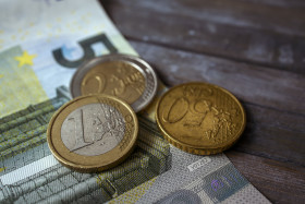 Stock Image: Euro money on wooden background