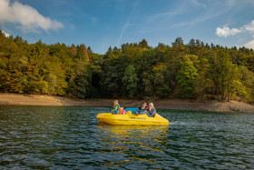 Stock Image: Family in yellow boat on a lake