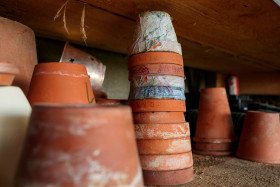 Stock Image: Flower pots stacked on top of each other on a shelf