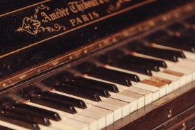 Stock Image: Forgotten Melodies: Old Piano in an Abandoned Setting