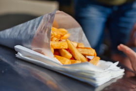 Stock Image: French fries in paper snack bag