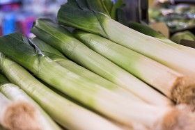 Stock Image: Fresh leeks on display at the market