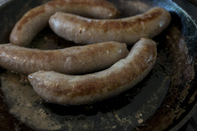 Stock Image: fried sausages in a pan