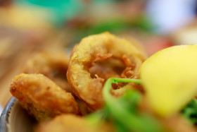 Stock Image: Fried squid rings breaded with lemon