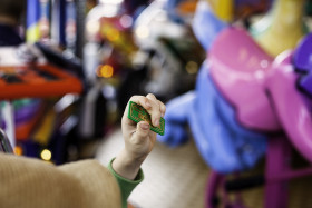 Stock Image: funfair card in children hand