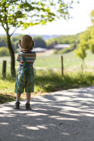 Stock Image: Little farmer child in dungarees