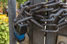 Stock Image: gate with chains and padlock