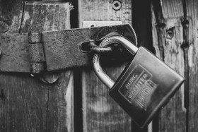 Stock Image: gate with padlock black and white