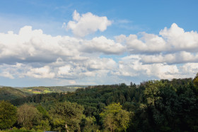 Stock Image: German forest landscape with beautiful clouds