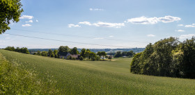 Stock Image: German rural landscape near Velbert Langenberg with fields and hills and a Farm in Background
