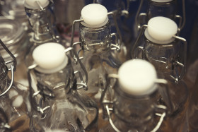 Stock Image: glass bottles with plastic cork stopper