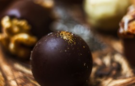 Stock Image: gold leaf decorated chocolate praline