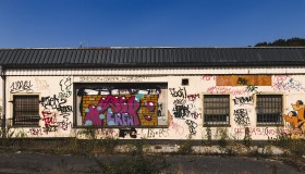 Stock Image: graffiti on old small train station building