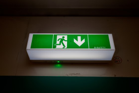 Stock Image: Green emergency exit sign