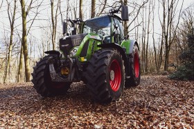 Stock Image: green tractor in the forest