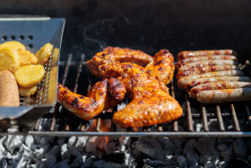 Stock Image: Grilling meat on a charcoal grill